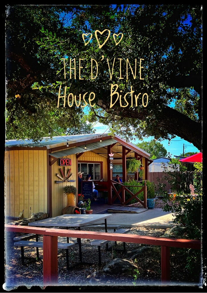 D'Vine House Bistro welcome sign under the shade of a live oak tree